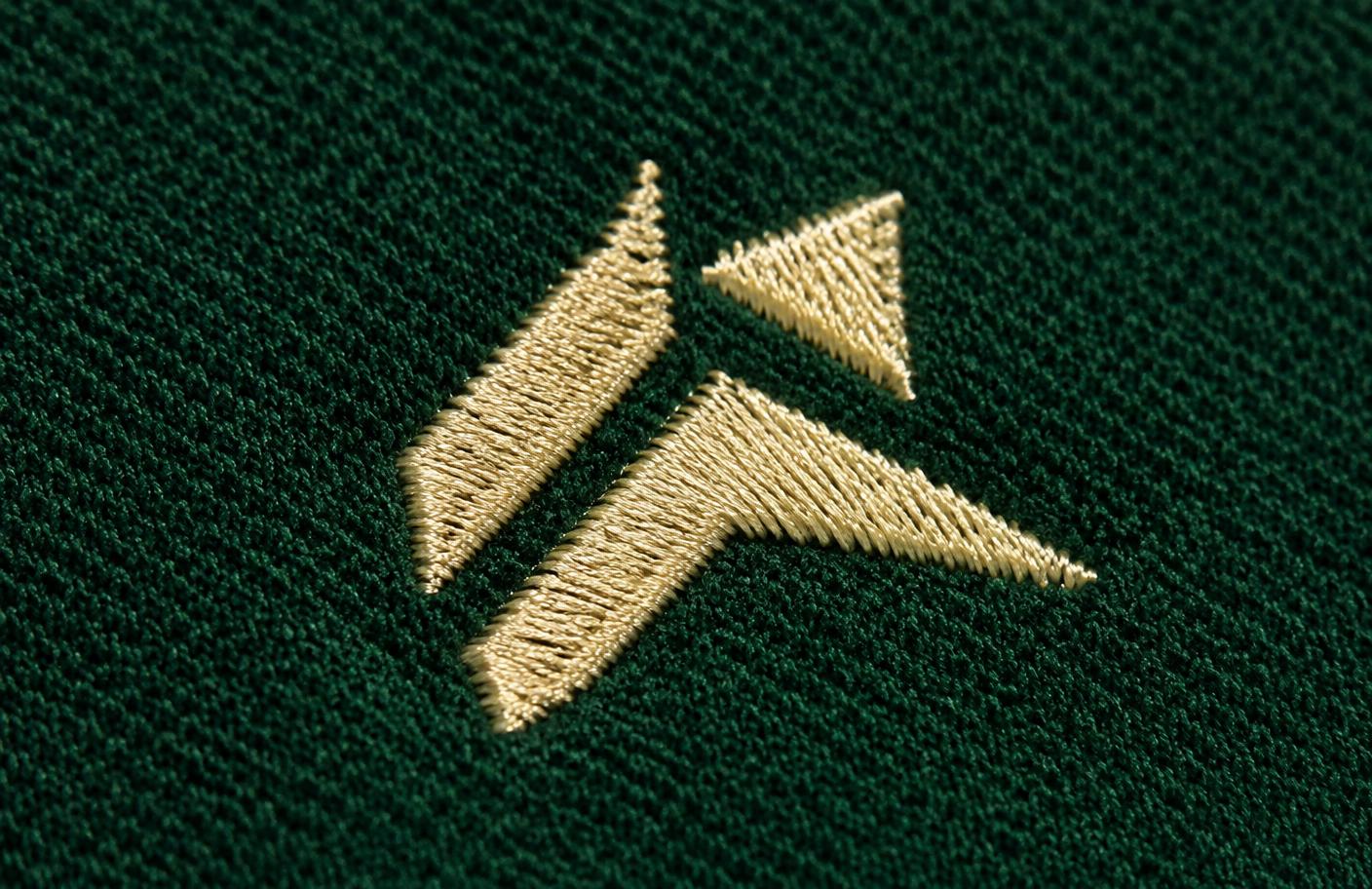 Close-up of an embroidered level mark